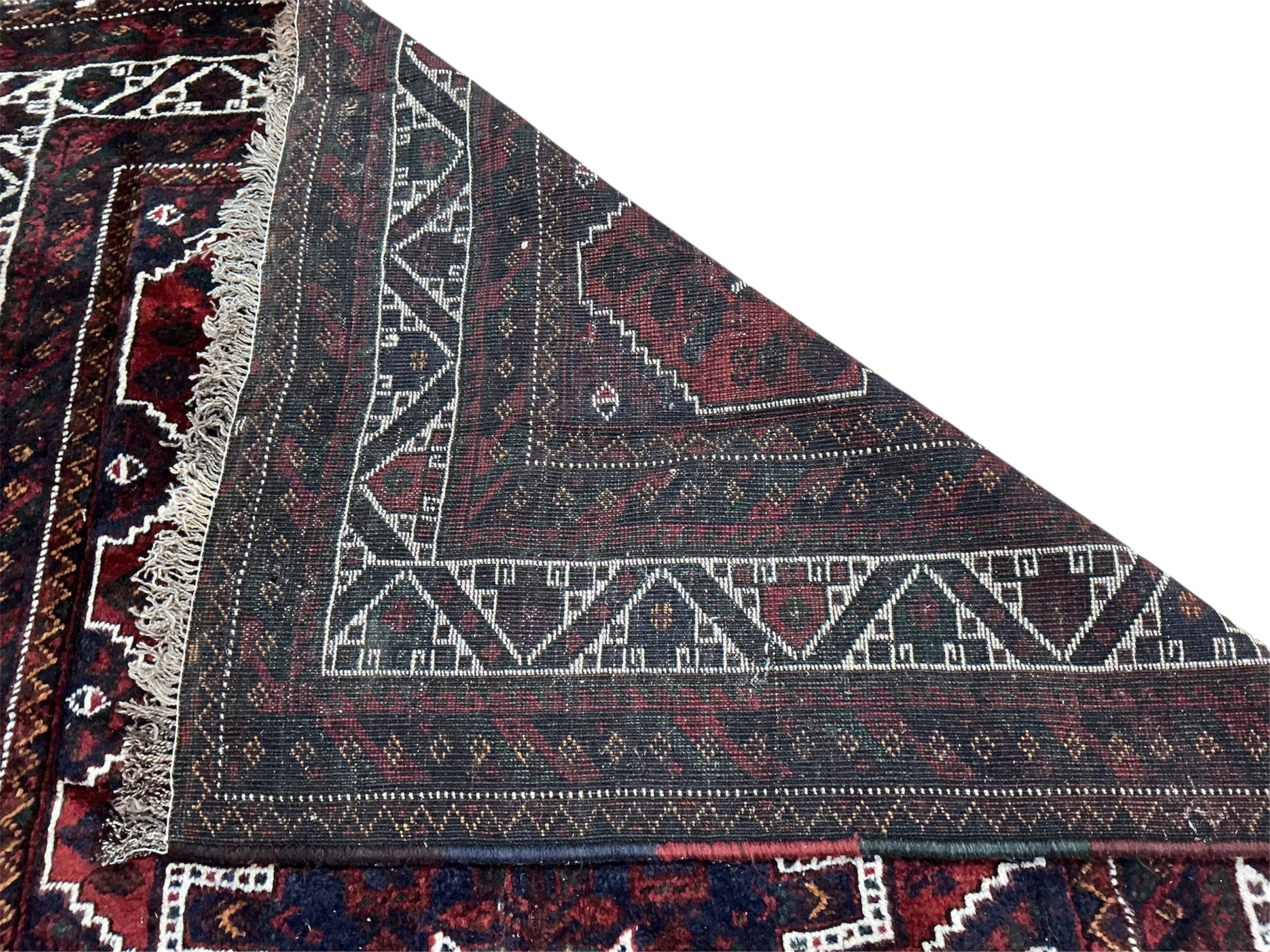 A Hamadan blue ground rug, 220cm x 160cm.